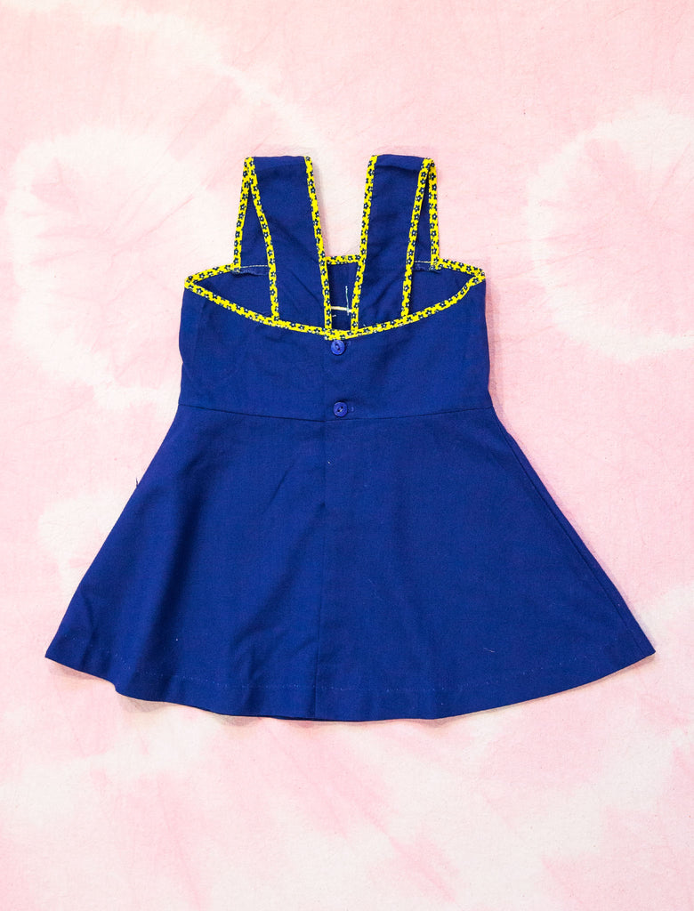 black detail of joey rainbow kids 60s vintage blue dress with pumpkin 